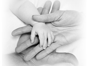 image of parent and infant hands